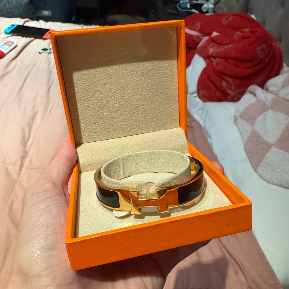 Gold and Black Fashion Bracelet in Orange Box